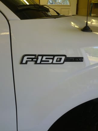 F150 emblem painted black and white overlay