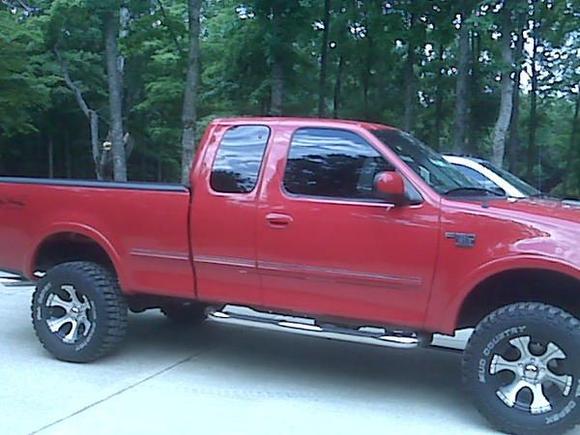 4inch lift 33 12.5 dick cepeck mud countries on DC-1 black and brushed chrome wheels, tented to mach all the way around, duals 45 behind the rear wheels, edge programmer,cold air, 6.1 inch touchscreen radio/nav system, and more on the way