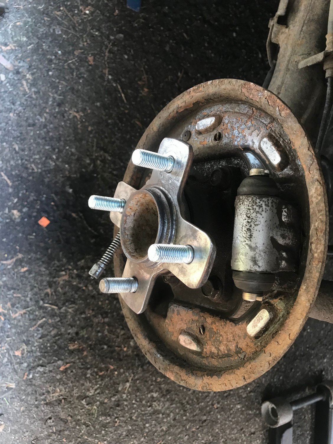 3/4 new studs. Yeah! Managed to push out the stupid cylinder piston while installing the new shoes. Told myself I would never do that again then did it again on the other side. I had recently bled the brakes so I easily cracked open the bleeders and bled both sides and got rid of the air. 