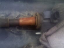 Loose spark plug went undetected and stained a coil!