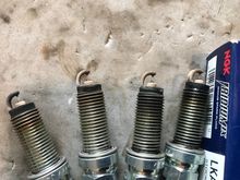 Old plugs, cylinder 1 through 4, from left to right. Electrode gap still looks ok but there are some whiteish deposits on the insulator and the ground electrode, probably from leaky valve seals. 
