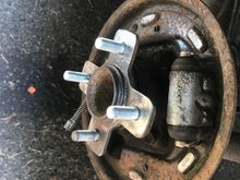 3/4 new studs. Yeah! Managed to push out the stupid cylinder piston while installing the new shoes. Told myself I would never do that again then did it again on the other side. I had recently bled the brakes so I easily cracked open the bleeders and bled both sides and got rid of the air. 