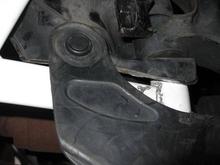 This is the right side with the plastick mud flap installed over the bar. Right front corner. Down is forward on the car.
