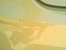 Small scuff/scratch on rear bumper (driver's side).