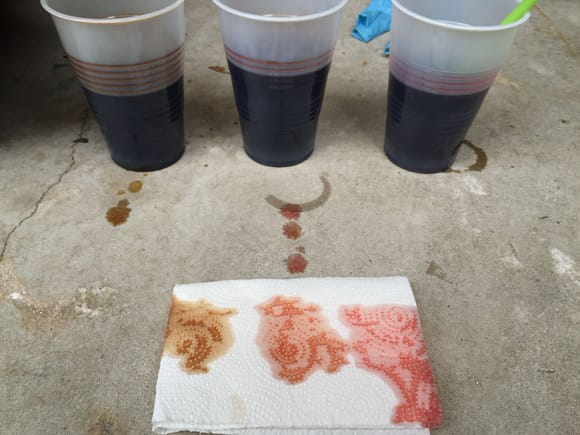 Left to right: 69,000 mile ATF fluid from reservoir, results from first flush, results from second flush