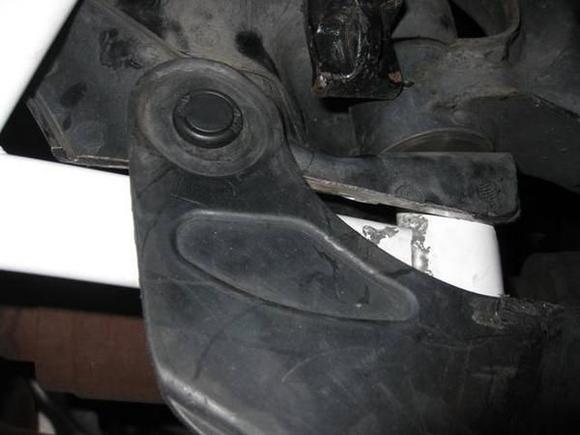 This is the right side with the plastick mud flap installed over the bar. Right front corner. Down is forward on the car.
