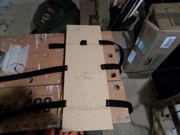 Bottom board with velcro staps stapled on.