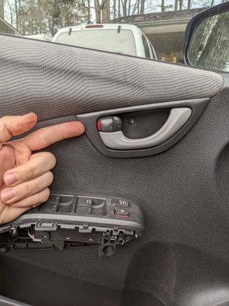 Now we come back to the door handle whose screw we already removed. Slide it to the right (toward the car) and pull it out towards you. It'll come out easily. I'll attach an image of the clips that hold it in place so that you can understand what's holding it in and how not to break it.