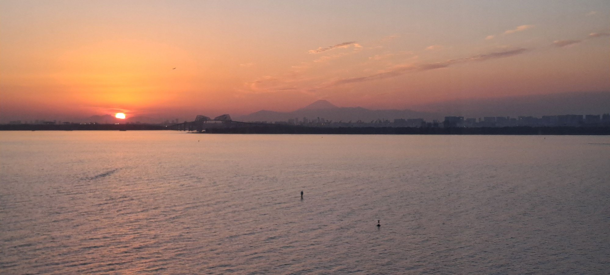 Ocean view from 11th floor hilton tokyo bay at sunset. Mt fuji just visble also