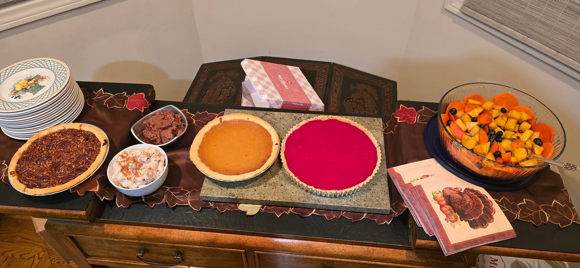 Left to right, pecan pie, cinnamon and chocolate whipped creams (I know, I know, Im a purist), pumpkin pie, cranberry curd tart (lots more on this one in the