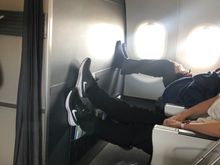 2 minutes into boarding. The CSM has at least now told the man to put his shoes back on!