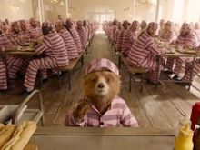 Image from Paddington 2 - scene with prisons in pink tint clothes