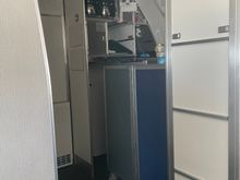 Flight Attendant barricade (she was sitting behind here watching a video on her phone most of the flight)