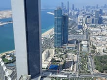 View of Abu Dhabi ( old Abu Dhabi National Oil Company HQ in the foreground beside the new HQ)  along the Corniche from the Observation deck @300 on floor 74 at the adjacent tower at conrad abu dhabi- just walk across the lobby from the hotel elevators). Free for Conrad guests 