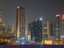 View towards Burj Khalifa from pool deck at night