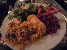 The first station offered bread, salad, vegetables, lamb biryani, and various meats that I will come back for.