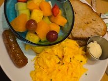 Standard hotel breakfast for elites. One of the option choices (fruit, sausage, scrambled eggs), plus toast.