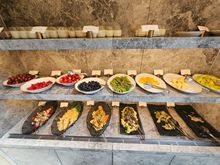 Yogurts, fruits, and various cold salads