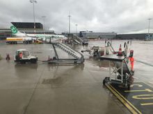 Disembarking the aircraft will be via uncovered stairs,
(There are covered stairs but these were in use by a Transavia flight who arrived just before us)