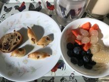 This one shows the Moroccan blueberries , Malaysian pomelo & papaya , Thai longans and bacon twists & raisin bread . Along with iced latte & water with lots of ice cubes 