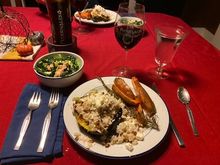 Acorn squash with herb and nut rice stuffing, rosemary sweet potatoes, and kale & Brussels sprouts salad with homemade lemon vinaigrette