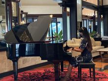 Club lounge has live music with pianist