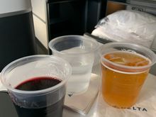 Bordeaux, water, and juice! They actually had two reds to choose from on this flight...