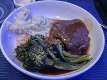 seared short rib with green peppercorn sauce. fork tender and very tasty. the sauce was more salty like soy sauce than peppery. broccolini had a good smoky flavor from being grilled.