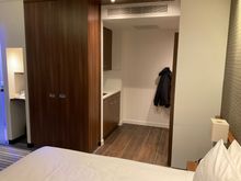 View from bed towards the kitchenette and room entrance 