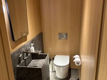 The suite also includes a guest powder room in the entryway.