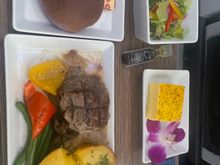 Shockingly good in F from KOA-SEA today, 8/2 AS854. That would be a Taro/Ube (couldn’t tell) roll, with the beef filet, salad, and a sort of passionfruit cake. Normally meals are decent, good microwave quality, but today was awesome. Great job Alaska!

We did not get a cookie but perhaps the cake makes up for that.