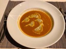 Lobster bisque with seafood / scallops ravioli 