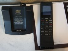 This phone and its charger were basically the only parts of the room made of plastic.  Very light but cheap-feeling handset.