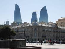 From many locations, the Flame Towers seem to rise above the City
