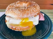 Ham, egg and cheese breakfast sandwich on a Chompie’s sesame seed bagel 