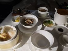 Chicken and shimeji mushroom congee with dim sum selection - har gow, chive dumpling, siu mai