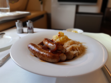Roast Sausages Nuremberg Style with Beer and Onion Sauce, Sauerkraut, mashed Potatoes
