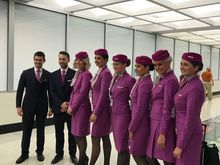 Flight attendants from both arriving and departing flights.