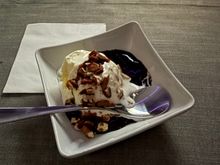 Ice cream with fudge and nuts in square dish, unsure if this route would typically have the full Flagship sundae