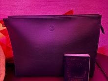MacBook sized amenity kit with Georgio Armani pyjamas in F (passport for scale)