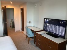 The bedroom has a second TV, in the cupboard below it....
