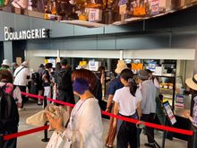 French pavilion - separate lines for the pavilion exhibit and the pavilion food concession separated by the red tape.