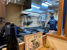 Typical counter place though with two tables for four (Japanese style with a footwell for westerners)