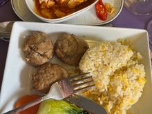 An eggy rice, slice of carrot, baby pan choi, three beef burgers and the salmon.