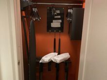 Extra closet in the bedroom with the safe, iron & board, shoehorn, extra pillow and blanket