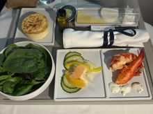 Lobster starter and salad, with cheese and dessert course served on the tray on short red eyes