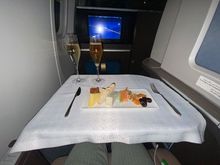 Cheese plate, white wine and champagne after take off