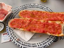 Breakfast of cafe con leche and pitufo con aceite y tomate