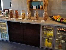 How the new Afternoon Tea at Hilton Tower Bridge now looks. Not the addition of cereal bars, note the removal of pretty much anything else, including a few very sad looking fridges.