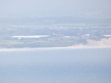 In the distance we could see the white tents erected at Portrush, for the British Open. There was zoom involved here.